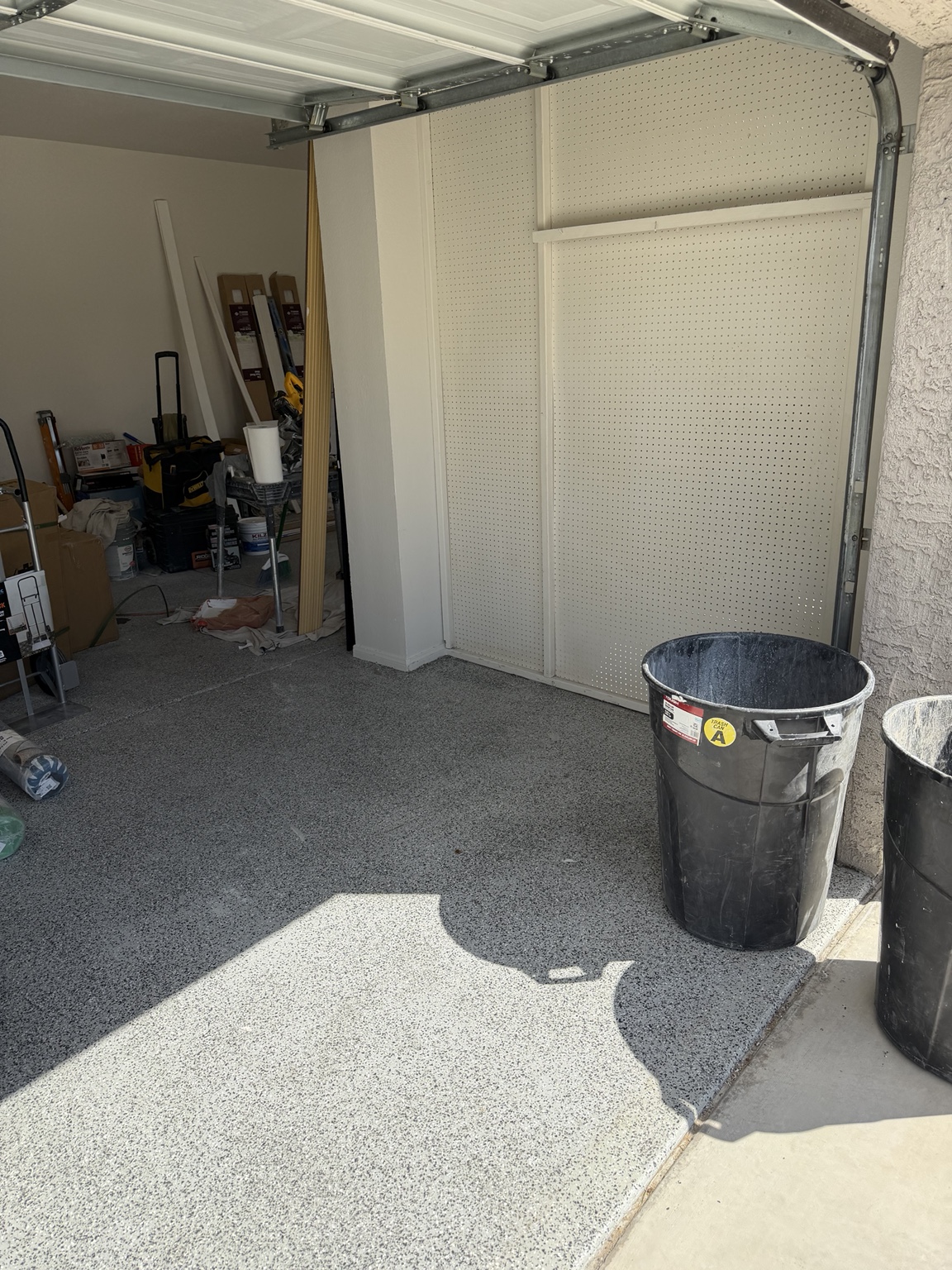 After: the same garage corner cleared of boxes, foam and bags